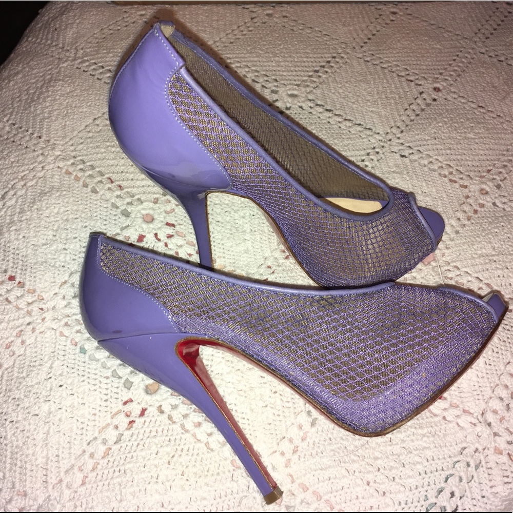 Christian Louboutin purple high heel shoes.